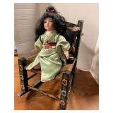 Painted rocking chair with doll