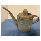 Antique metal watering can