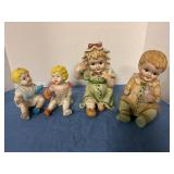 Ceramic piano dolls, one has repaired arm see pics