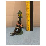 Vintage Hand-painted cast iron drink mon on a lamp