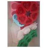 Silicone Molds in Lidded Plastic Bin