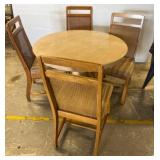 Round Dining Table with Four Cane-Back Chairs