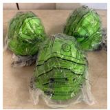 Three Green Safety Helmets in Packaging