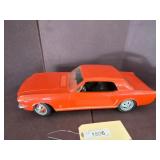 Red Model Ford Mustang with Chrome Accents