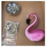Glass Flamingo, Beaded Bracelets, and Metal Bowl