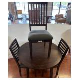 Round Dining Table with Four Upholstered Chairs