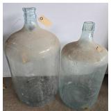 Two Clear Glass Demijohn Bottles