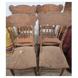 Four Wooden Chairs with Carved Accents