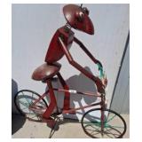 Metal Sculpture of Ant on Bicycle