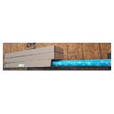 Gift Wrap Rolls and Cardboard Boxes on Shelf