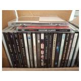 CDs and a Gold-Toned Curling Iron
