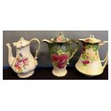 Three Floral Handpainted Ceramic Pitchers