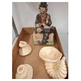 Figurine with Book and Cream Ceramic Shell Decor