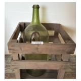 Green Glass Bottle in Wooden Crate
