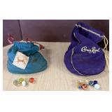 Two Drawstring Bags Containing Assorted Marbles