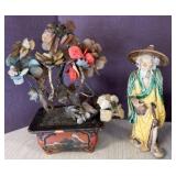 Ceramic Figurine and Stone Flower Arrangement