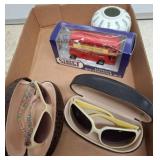 Items Including Vase, Sunglasses, Bus