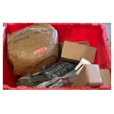Red Crate With Abrasive and Hardware Items