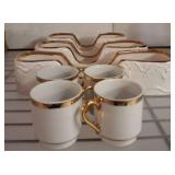 Gold-Rimmed Ceramic Mugs and Serving Dishes