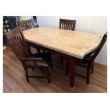 Dining Table with Four Wood and Vinyl Chairs