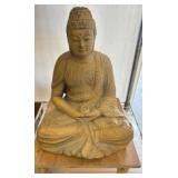Painted Buddha Statue on Wooden Stand