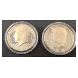 Two Kennedy Half Dollars in Protective Cases