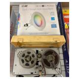 Vintage Reel-to-Reel Tape Player and Smart Downlig
