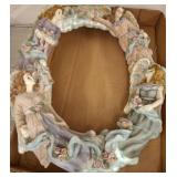 Oval Wall Decor With Angel Motif and Floral Detail