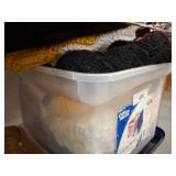 Plastic Bin With Knitted Blankets
