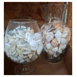 Two Glass Vases Filled With Assorted Seashells