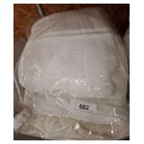 Bundle of White Textiles blankets in Plastic Bags