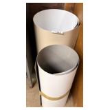 Partial Coils of White and Gray Vinyl Materials