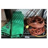 Green Tarp and Assorted Extension Cords