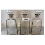 Three Glass Decanters with Stoppers