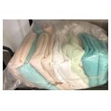 Plastic-Wrapped Lot of Towels in Pastel Colors