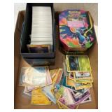 Pokemon Cards in Boxes and Tins
