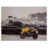 Canvas Print of Motorcycle by a Marina
