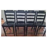 Four Black Ladder-Back Wooden Chairs