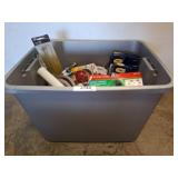 Gray Bin Containing Assorted Plumbing Supplies
