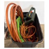 Plastic Bin with Hoses and Extension Cords