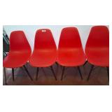 Four Molded Red Plastic Chairs