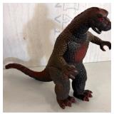 Brown and Red Dinosaur Figure with Marked Base