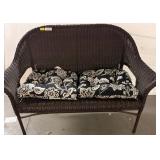 Brown Wicker Loveseat with Floral Cushions