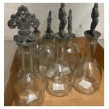 Six Glass Bottles with Metal Stoppers