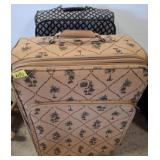 Two Patterned Rolling Suitcases