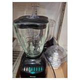 Two Black Kitchen Appliances with Accessories