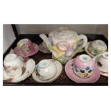 Teapot and Assorted Cups with Saucers