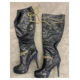 Black Knee-High Boots with Gold Chain Accents