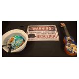Decorative Set: Sign, Toy Guitar, and Beaded Items