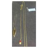 Gold Chains and Assorted Jewelry Accents